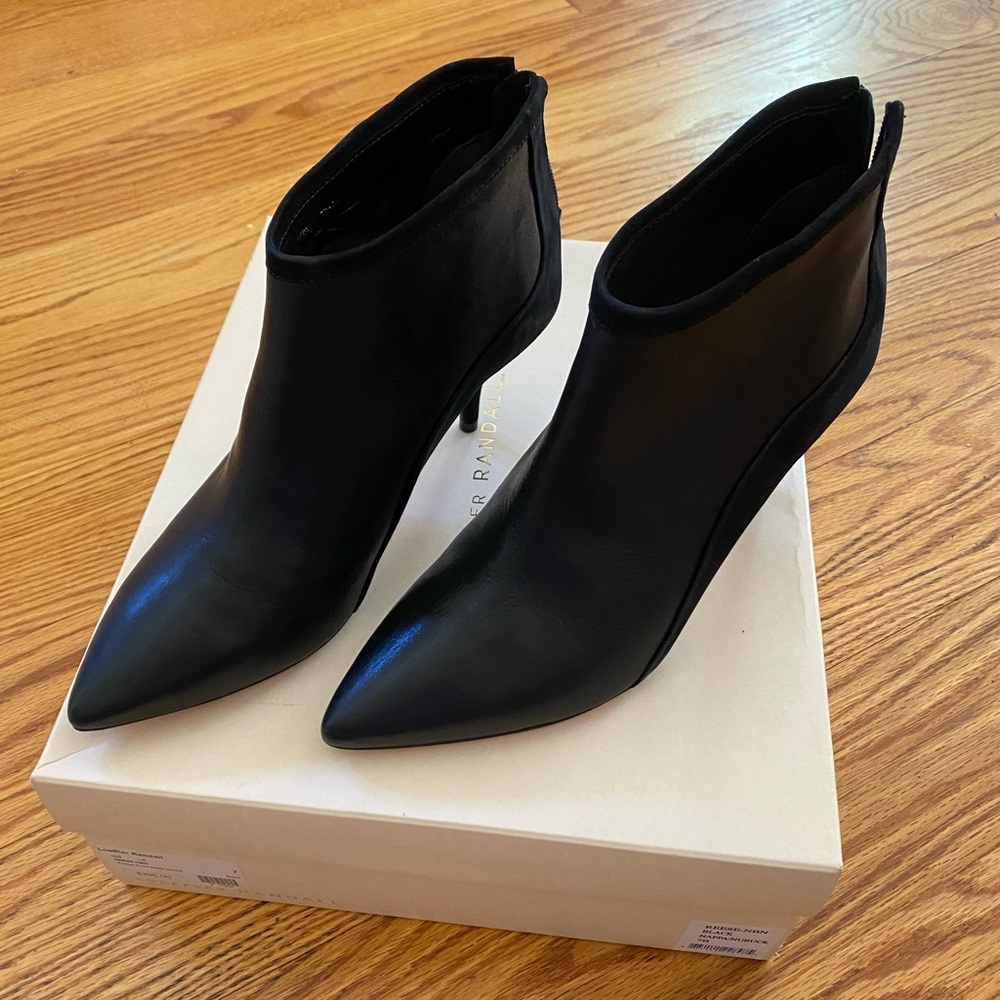 Never worn. Gorgeous black kitten heel bootie. Zip up in back. Size 7- pad $395